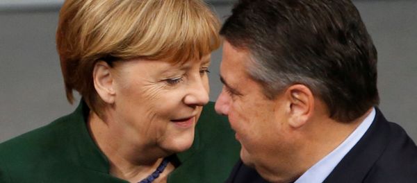 German Chancellor Angela Merkel and Economy Minister Sigmar Gabriel attend a meeting at the lower house of parliament Bundestag on 2017 budget in Berlin, Germany, November 23, 2016. German Chancellor Angela Merkel and Economy Minister Sigmar Gabriel attend a meeting at the lower house of parliament Bundestag on 2017 budget in Berlin, Germany, November 23, 2016. - Sputnik International
