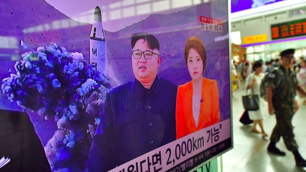A South Korean soldier (R) walks past a television screen reporting news of North Korea's latest submarine-launched ballistic missile test at a railway station in Seoul on August 25, 2016 A South Korean soldier (R) walks past a television screen reporting news of North Korea's latest submarine-launched ballistic missile test at a railway station in Seoul on August 25, 2016 - Sputnik International