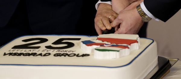 Prime Ministers of Czech Republic Bohuslav Sobotka, Poland Beata Szydlo, Hungary Viktor Orban, and Slovakia Robert Fico, join hands to cut a cake to celebrate 25th anniversary of the establishment of the Visegrad group prior to a Summit of the V4 Prime Ministers with the Prime Minister of Bulgaria and the President of Macedonia in Prague, Czech Republic, Monday, Feb. 15, 2016 - Sputnik International