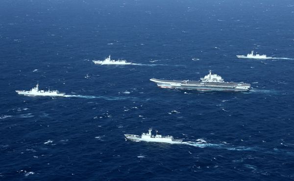 China's Liaoning aircraft carrier with accompanying fleet conducts a drill in an area of South China Sea in this undated photo taken December, 2016 - Sputnik International