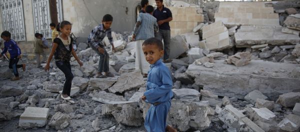 In this Sept. 8, 2015 file photo, children play amid the rubble of a house destroyed by a Saudi-led airstrike in Sanaa, Yemen In this Sept. 8, 2015 file photo, children play amid the rubble of a house destroyed by a Saudi-led airstrike in Sanaa, Yemen - Sputnik International