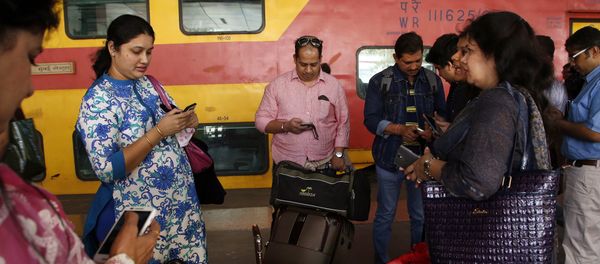 Indian travellers use a free WiFi service to browse the net at Mumbai Central Train Station in Mumbai, India, Friday, Jan. 22, 2016 Indian travellers use a free WiFi service to browse the net at Mumbai Central Train Station in Mumbai, India, Friday, Jan. 22, 2016 - Sputnik International