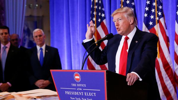 Vice President-elect Mike Pence is seen in the background as U.S. President-elect Donald Trump speaks during a press conference in Trump Tower, Manhattan, New York, U.S., January 11, 2017 Vice President-elect Mike Pence is seen in the background as U.S. President-elect Donald Trump speaks during a press conference in Trump Tower, Manhattan, New York, U.S., January 11, 2017 - Sputnik International