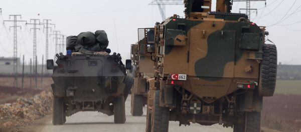 Turkish military vehicles drive in the Syrian rebel-held town of al-Rai, as they head towards the northern Syrian town of al-Bab, Syria January 4, 2017 - Sputnik International