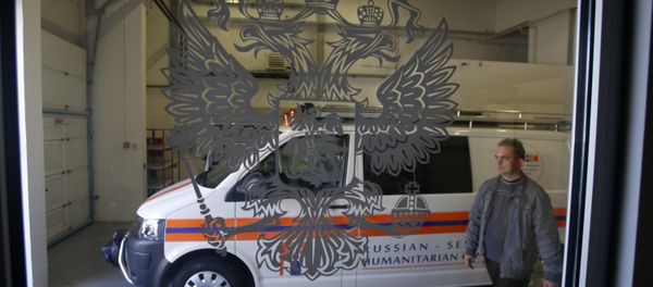 In this Thursday, Sept. 29, 2016 photo, a worker passes by a rescue mission van in a warehouse in a Russian-Serbian Humanitarian Center near an airport in the town of Nis, Serbia In this Thursday, Sept. 29, 2016 photo, a worker passes by a rescue mission van in a warehouse in a Russian-Serbian Humanitarian Center near an airport in the town of Nis, Serbia - Sputnik International