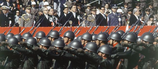 Japan’s ground self-defense forces military parade goes past a reviewing stand during the defense force’s annual parade in Asaka, Saitama prefecture, north of Tokyo, Oct. 30, 1983 Japan’s ground self-defense forces military parade goes past a reviewing stand during the defense force’s annual parade in Asaka, Saitama prefecture, north of Tokyo, Oct. 30, 1983 - Sputnik International