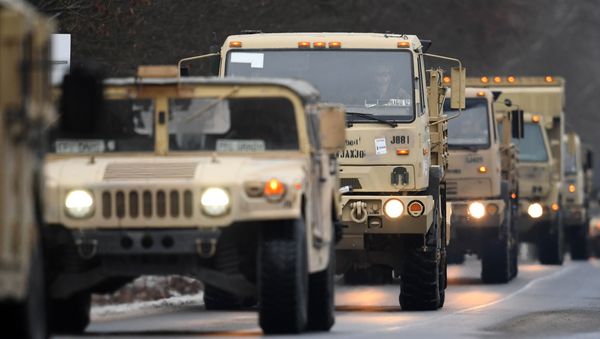 US military vehicles make their way on an army training camp near Brueck, northeastern Germany, on January 11, 2017 US military vehicles make their way on an army training camp near Brueck, northeastern Germany, on January 11, 2017 - Sputnik International
