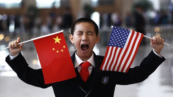 A little boy who is waiting to greet U.S. Secretary of State Hillary Rodham Clinton at the National Museum in Beijing makes a face while holding U.S. and Chinese flags Friday, May 4, 2012 A little boy who is waiting to greet U.S. Secretary of State Hillary Rodham Clinton at the National Museum in Beijing makes a face while holding U.S. and Chinese flags Friday, May 4, 2012 - Sputnik International