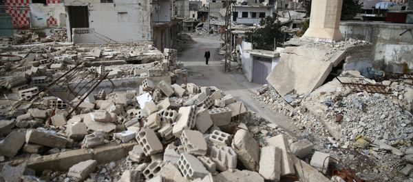 A man walks past damaged buildings in the rebel held besieged city of Douma, in the eastern Damascus suburb of Ghouta, Syria January 8, 2017 A man walks past damaged buildings in the rebel held besieged city of Douma, in the eastern Damascus suburb of Ghouta, Syria January 8, 2017 - Sputnik International