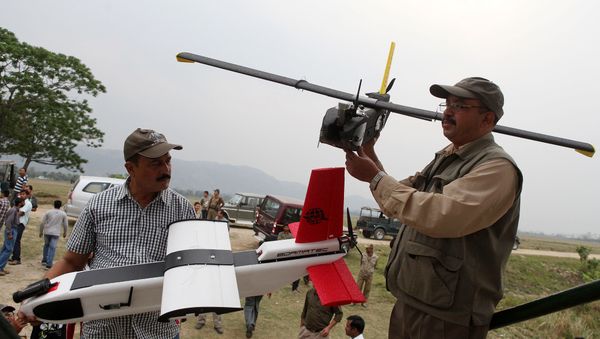 Indian forestry officials hold up unmanned aerial vehicles (UAV) during a demonstration to the media at the Kaziranga National Park, some 250 kilometers east of Guwahati (File) Indian forestry officials hold up unmanned aerial vehicles (UAV) during a demonstration to the media at the Kaziranga National Park, some 250 kilometers east of Guwahati (File) - Sputnik International