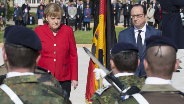 French President Francois Hollande (R) and German Chancellor Angela Merkel review a military honour guard during a welcoming ceremony prior to the 18th Franco-German cabinet meeting in Metz, eastern France, on April 7, 2016. French President Francois Hollande (R) and German Chancellor Angela Merkel review a military honour guard during a welcoming ceremony prior to the 18th Franco-German cabinet meeting in Metz, eastern France, on April 7, 2016. - Sputnik International