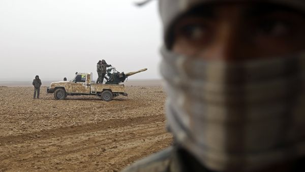 Fighters from the Kurdish-Arab alliance, known as the Syrian Democratic Forces, are seen near the village of Khirbet al-Jahshe, some 35 kilometres from al-Tabaqah on the western outskirts of Raqa as they advance towards the Islamic State (IS) group bastion on December 13, 2016 Fighters from the Kurdish-Arab alliance, known as the Syrian Democratic Forces, are seen near the village of Khirbet al-Jahshe, some 35 kilometres from al-Tabaqah on the western outskirts of Raqa as they advance towards the Islamic State (IS) group bastion on December 13, 2016 - Sputnik International