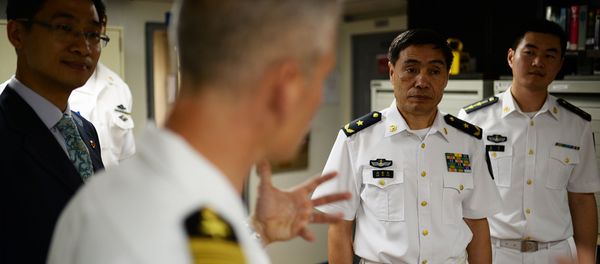Capt. Kyle P. Higgins, commanding officer of the U.S. 7th Fleet flagship USS Blue Ridge, conducts a ship tour with Vice Adm. Jinlong Shen of the People's Liberation Army Navy. Capt. Kyle P. Higgins, commanding officer of the U.S. 7th Fleet flagship USS Blue Ridge, conducts a ship tour with Vice Adm. Jinlong Shen of the People's Liberation Army Navy. - Sputnik International