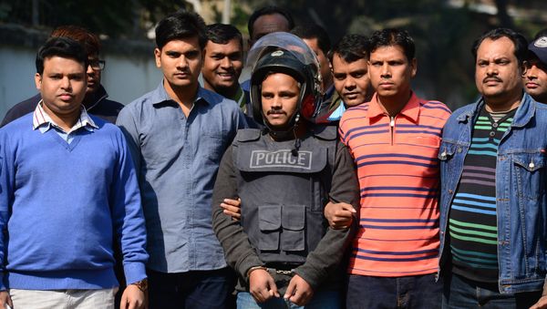Bangladesh police escort alleged Islamist militant Jahangir Alam (C) in Dhaka on January 14, 2017, after his arrest in connection with an attack on the Holey Artisan Bakery attack last year Bangladesh police escort alleged Islamist militant Jahangir Alam (C) in Dhaka on January 14, 2017, after his arrest in connection with an attack on the Holey Artisan Bakery attack last year - Sputnik International