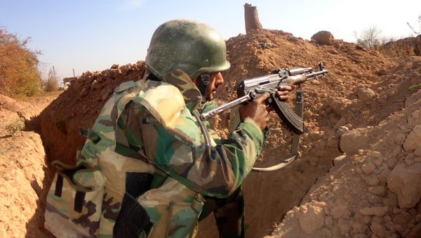 A Syrian army soldier takes aim in the government sector of the town of Houwayqa, which is besieged by Islamic State (IS) group jihadists, in the northeastern Syrian city of Deir Ezzor (File) A Syrian army soldier takes aim in the government sector of the town of Houwayqa, which is besieged by Islamic State (IS) group jihadists, in the northeastern Syrian city of Deir Ezzor (File) - Sputnik International
