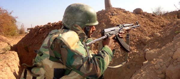 A Syrian army soldier takes aim in the government sector of the town of Houwayqa, which is besieged by Islamic State (IS) group jihadists, in the northeastern Syrian city of Deir Ezzor (File) A Syrian army soldier takes aim in the government sector of the town of Houwayqa, which is besieged by Islamic State (IS) group jihadists, in the northeastern Syrian city of Deir Ezzor (File) - Sputnik International
