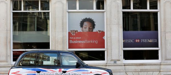 A taxi drives past a branch of HSBC bank in London, Britain, February 9, 2015. A taxi drives past a branch of HSBC bank in London, Britain, February 9, 2015. - Sputnik International