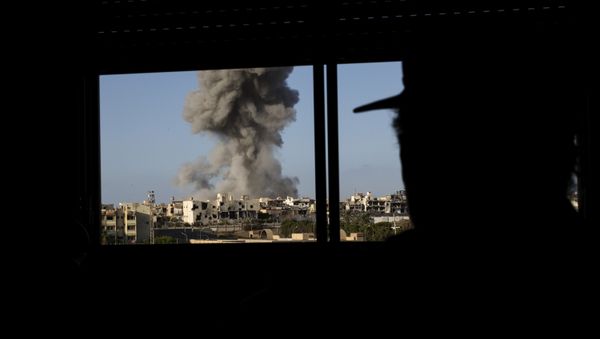 Smoke rise after an airstrike on the District 3 of Sirte, the last stronghold of Islamic State (IS) (File) - Sputnik International