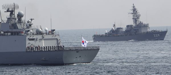South Korea's Dea Joyeong vessel travels alongside the Japanese escort ship “Abukuma” during an event held ahead of Sunday's official triennial Maritime Self-Defense Force fleet review off Sagami Bay, south of Tokyo, Japan, Thursday, Oct. 15, 2015 South Korea's Dea Joyeong vessel travels alongside the Japanese escort ship “Abukuma” during an event held ahead of Sunday's official triennial Maritime Self-Defense Force fleet review off Sagami Bay, south of Tokyo, Japan, Thursday, Oct. 15, 2015 - Sputnik International