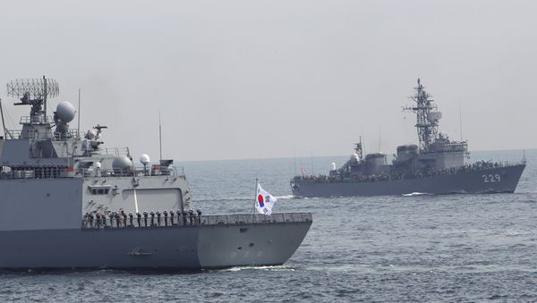 South Korea's Dea Joyeong vessel travels alongside the Japanese escort ship “Abukuma” during an event held ahead of Sunday's official triennial Maritime Self-Defense Force fleet review off Sagami Bay, south of Tokyo, Japan, Thursday, Oct. 15, 2015 South Korea's Dea Joyeong vessel travels alongside the Japanese escort ship “Abukuma” during an event held ahead of Sunday's official triennial Maritime Self-Defense Force fleet review off Sagami Bay, south of Tokyo, Japan, Thursday, Oct. 15, 2015 - Sputnik International