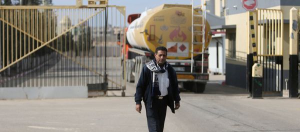 A man stands as a fuel tanker arrives at Gaza's power plant in the central Gaza Strip January 16, 2017 A man stands as a fuel tanker arrives at Gaza's power plant in the central Gaza Strip January 16, 2017 - Sputnik International