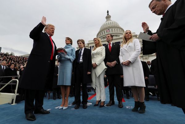 U.S. President Donald Trump takes the oath of office as his wife Melania holds the bible and his children Barron, Ivanka, Eric and Tiffany watch as U.S. Supreme Court Chief Justice John Roberts (R) administers the oath during inauguration ceremonies swearing in Trump as the 45th president of the United States on the West front of the U.S. Capitol in Washington, DC, U.S., January 20, 2017 - Sputnik International
