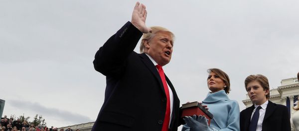 U.S. President Donald Trump takes the oath of office as his wife Melania holds the bible and his children Barron, Ivanka, Eric and Tiffany watch as U.S. Supreme Court Chief Justice John Roberts (R) administers the oath during inauguration ceremonies swearing in Trump as the 45th president of the United States on the West front of the U.S. Capitol in Washington, DC, U.S., January 20, 2017 U.S. President Donald Trump takes the oath of office as his wife Melania holds the bible and his children Barron, Ivanka, Eric and Tiffany watch as U.S. Supreme Court Chief Justice John Roberts (R) administers the oath during inauguration ceremonies swearing in Trump as the 45th president of the United States on the West front of the U.S. Capitol in Washington, DC, U.S., January 20, 2017 - Sputnik International