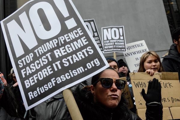 A woman holds an anti-Trump sign during inauguration protests in New York City. - Sputnik International