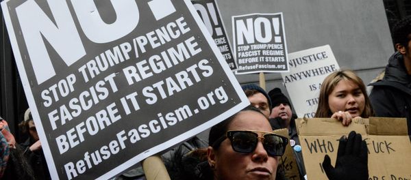 A woman holds an anti-Trump sign during inauguration protests in New York City. - Sputnik International