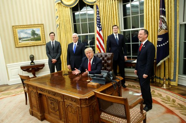 US President Donald Trump, flanked by Senior Advisor Jared Kushner (standing, L-R), Vice President Mike Pence, Staff Secretary Rob Porter and Chief of Staff Reince Priebus, welcomes reporters into the Oval Office for him to sign his first executive orders at the White House in Washington, US January 20, 2017. - Sputnik International