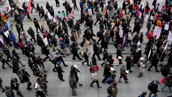 People march in protest to U.S. President Donald Trump's inauguration in Seattle, Washington, U.S. January 20, 2017 People march in protest to U.S. President Donald Trump's inauguration in Seattle, Washington, U.S. January 20, 2017 - Sputnik International