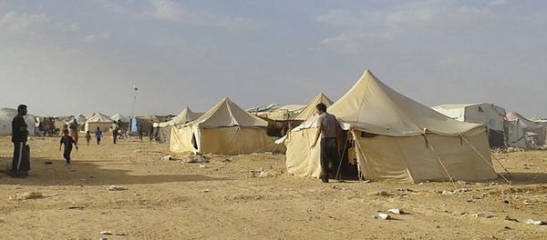 Syrians walk through the Ruqban refugee camp in Jordan's northeast border with Syria (File) Syrians walk through the Ruqban refugee camp in Jordan's northeast border with Syria (File) - Sputnik International