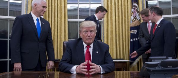 US President Donald Trump (C) waits at his desk before signing confirmations for James Mattis as US Secretary of Defense and John Kelly as US Secretary of Homeland Security, as Vice President Mike Pence (L) and White House Chief of Staff Reince Priebus (R) look on, in the Oval Office of the White House in Washington, DC, January 20, 2017 US President Donald Trump (C) waits at his desk before signing confirmations for James Mattis as US Secretary of Defense and John Kelly as US Secretary of Homeland Security, as Vice President Mike Pence (L) and White House Chief of Staff Reince Priebus (R) look on, in the Oval Office of the White House in Washington, DC, January 20, 2017 - Sputnik International