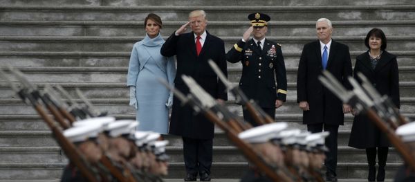 Newly inaugurated U.S. President Donald Trump (in red tie), first lady Melania (L), Vice President Mike Pence and his wife Karen (R) preside over a military parade during Trump's swearing ceremony in Washington, U.S., January 20, 2017 - Sputnik International