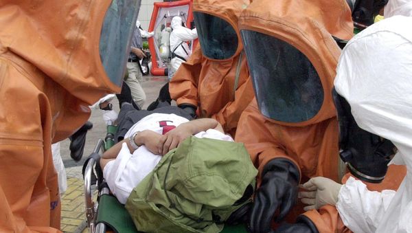Anti-bioterror squad policemen carry a mock victim during an anti-chemical, biochemical and radiological terror exercise (File) - Sputnik International