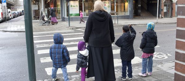 A norwegian muslim family is pictured at a crossroad in Oslo A norwegian muslim family is pictured at a crossroad in Oslo - Sputnik International