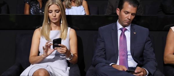 Republican Presidential Candidate Donald Trump's children Ivanka Trump and Donald Trump Jr., check on their phones during the second day session of the Republican National Convention in Cleveland, Tuesday, July 19, 2016. Republican Presidential Candidate Donald Trump's children Ivanka Trump and Donald Trump Jr., check on their phones during the second day session of the Republican National Convention in Cleveland, Tuesday, July 19, 2016. - Sputnik International