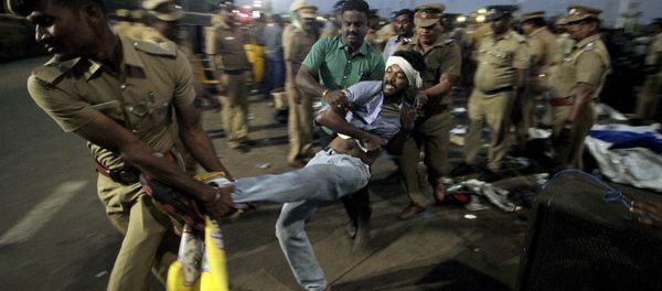 A protestor supporting Jallikattu, a traditional bull-taming ritual tries to resist as police remove them from the Marina beach on the Bay of Bengal coast in Chennai, India, Monday, Jan.23, 2017. A protestor supporting Jallikattu, a traditional bull-taming ritual tries to resist as police remove them from the Marina beach on the Bay of Bengal coast in Chennai, India, Monday, Jan.23, 2017. - Sputnik International