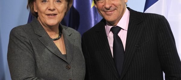German Chancellor Angela Merkel (L) and French Prime Minister Francois Fillon shake hands after a press conference following talks at the chancellery in Berlin March 10, 2010. T German Chancellor Angela Merkel (L) and French Prime Minister Francois Fillon shake hands after a press conference following talks at the chancellery in Berlin March 10, 2010. T - Sputnik International