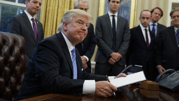 President Donald Trump looks up after signing the final of three executive orders, Monday, Jan. 23, 2017, in the Oval Office of the White House in Washington. (AP Photo/Evan Vucci) President Donald Trump looks up after signing the final of three executive orders, Monday, Jan. 23, 2017, in the Oval Office of the White House in Washington. (AP Photo/Evan Vucci) - Sputnik International