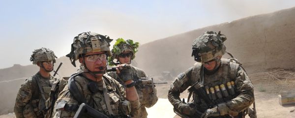 In this photo taken on August 5, 2011, US troops from the Charlie Company, 2-87 Infantry, 3d Brigade Combat Team under Afghanistan's International Security Assistance Force patrols Kandalay village following Taliban attacks on a joint US and Afghan National Army checkpoint protecting the western area of Kandalay village. In this photo taken on August 5, 2011, US troops from the Charlie Company, 2-87 Infantry, 3d Brigade Combat Team under Afghanistan's International Security Assistance Force patrols Kandalay village following Taliban attacks on a joint US and Afghan National Army checkpoint protecting the western area of Kandalay village. - Sputnik International