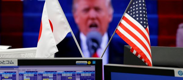 National flags of Japan and the U.S. are seen in front of a monitor showing U.S. President Donald Trump at a foreign exchange trading company in Tokyo, Japan, January 23, 2017 National flags of Japan and the U.S. are seen in front of a monitor showing U.S. President Donald Trump at a foreign exchange trading company in Tokyo, Japan, January 23, 2017 - Sputnik International