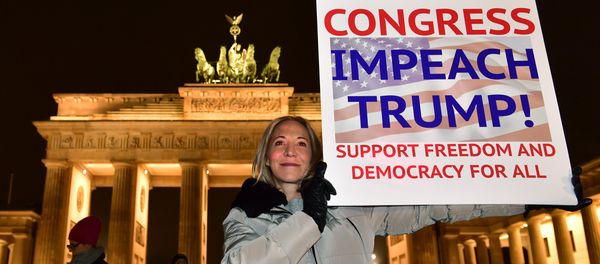 A protester shows a banner during an anti Donald Trump rally, on the day of his inauguration as US President, in front of Brandenburg Gate on January 20, 2017 in Berlin - Sputnik International