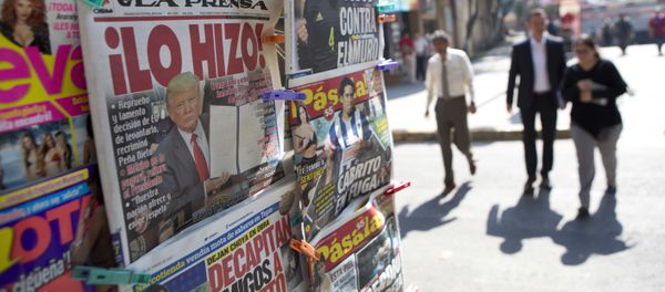 A front page newspaper headline reads He did it! over a picture of U.S. President Donald Trump holding up signed documents, as he took action to jumpstart construction on a promised border wall, in Mexico City, Thursday, Jan. 26, 2017 A front page newspaper headline reads He did it! over a picture of U.S. President Donald Trump holding up signed documents, as he took action to jumpstart construction on a promised border wall, in Mexico City, Thursday, Jan. 26, 2017 - Sputnik International