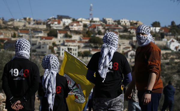 Palestinian protestors stand facing the Israeli settlement of Qadumim (Kedumim) during clashes with Israeli security forces following a demonstration against the expropriation of Palestinian land by Israel in the village of Kfar Qaddum, near Nablus, in the occupied West Bank on December 30, 2016 Palestinian protestors stand facing the Israeli settlement of Qadumim (Kedumim) during clashes with Israeli security forces following a demonstration against the expropriation of Palestinian land by Israel in the village of Kfar Qaddum, near Nablus, in the occupied West Bank on December 30, 2016 - Sputnik International