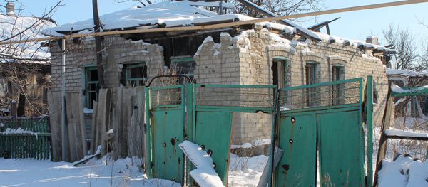 A destroyed house in Spartak village, Donetsk region A destroyed house in Spartak village, Donetsk region - Sputnik International