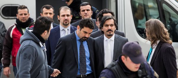 The eight Turkish soldiers, who fled to Greece in a helicopter and requested political asylum after a failed military coup against the government, are escorted by police officers as they arrive at the Supreme Court in Athens, Greece, January 26, 2017 The eight Turkish soldiers, who fled to Greece in a helicopter and requested political asylum after a failed military coup against the government, are escorted by police officers as they arrive at the Supreme Court in Athens, Greece, January 26, 2017 - Sputnik International
