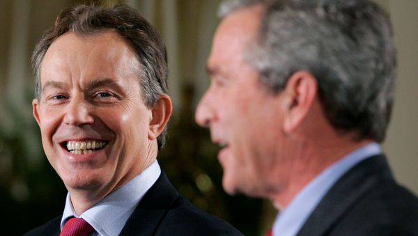 US President George W. Bush (R) and British Prime Minister Tony Blair attend a news conference in the East Room of the White House in Washington November 12, 2004.  - Sputnik International