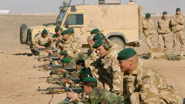 British Army officers from Operational Mentoring Liaison Training (OMLT) company train Afghan National Army or ANA, soldiers in firearms, near Camp Bastion, southern Afghanistan, Tuesday, Jan. 16, 2007. British Army officers from Operational Mentoring Liaison Training (OMLT) company train Afghan National Army or ANA, soldiers in firearms, near Camp Bastion, southern Afghanistan, Tuesday, Jan. 16, 2007. - Sputnik International