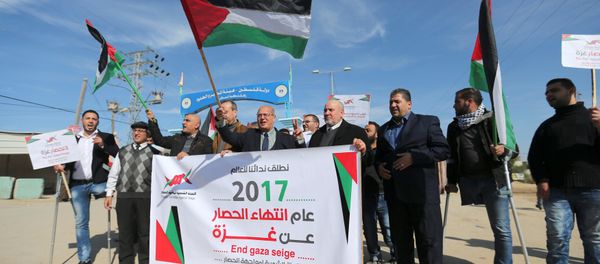 Palestinians take part in a protest against the Gaza blockade, near Israeli Erez crossing in the northern Gaza Strip January 5, 2017 Palestinians take part in a protest against the Gaza blockade, near Israeli Erez crossing in the northern Gaza Strip January 5, 2017 - Sputnik International